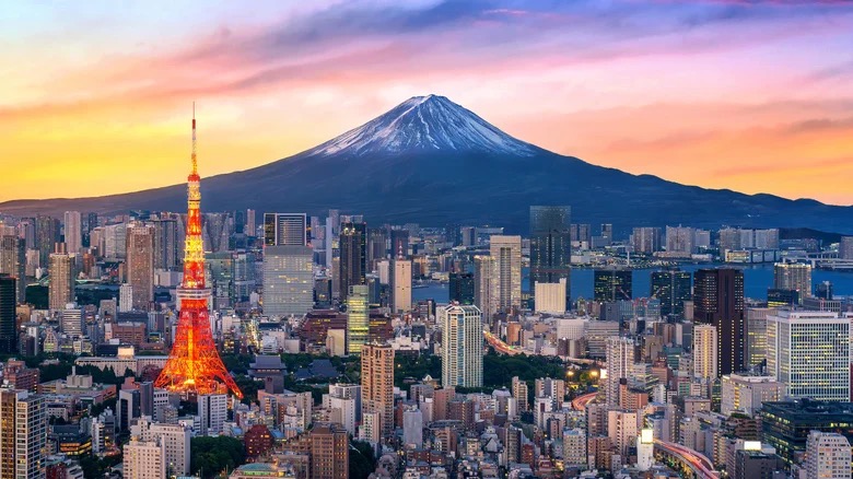 Tokyo Tower and the city skyline with Mount Fuji at sunset